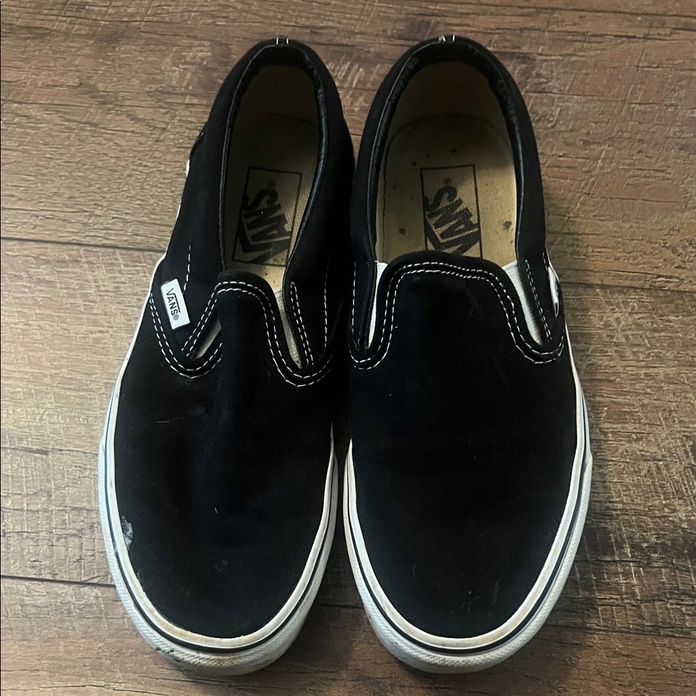 Vans women’s Black Slip-On Sneakers